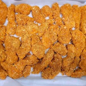 chicken strips laid out on a sheet pan