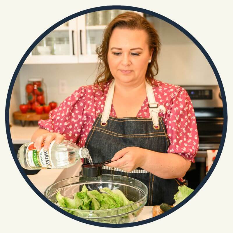 circle photo of Amy washing lettuce