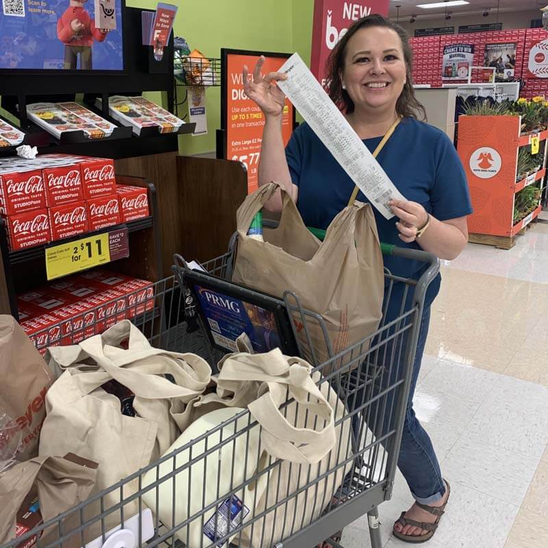 Amy Cross showing her receipt at the grocery store