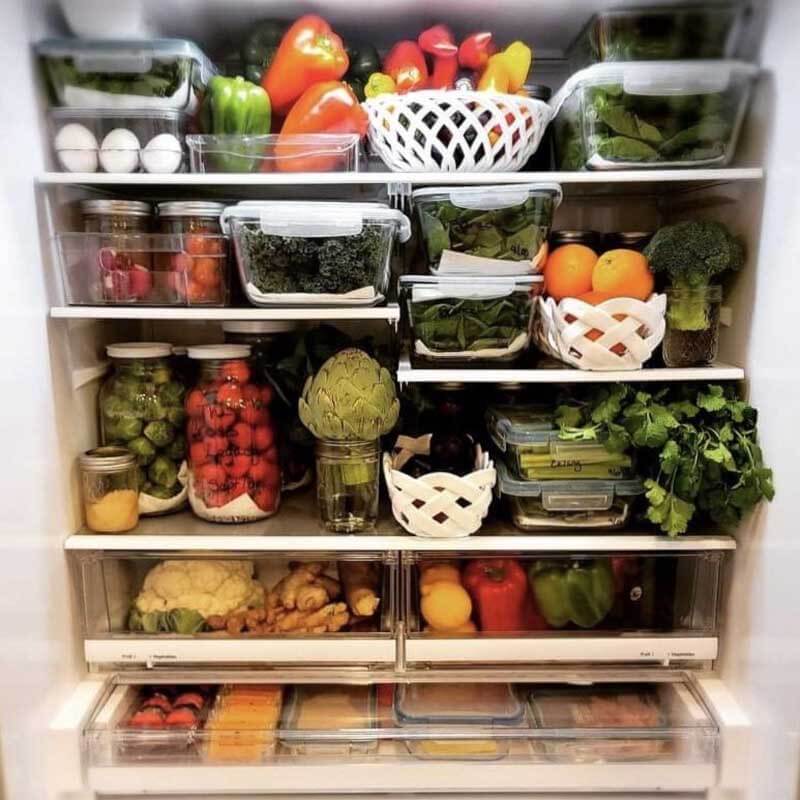 How long do artichokes last in the fridge? Amy Cross can make them last 3 weeks! Fridge filled with fresh produce washed and stored in glass storage containers.