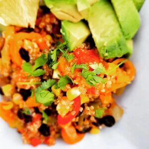 Mexican Quinoa Salad with Avocados on a white plate.